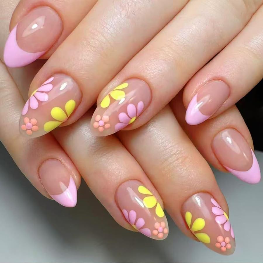 Nails with pink and yellow floral design on a neutral background