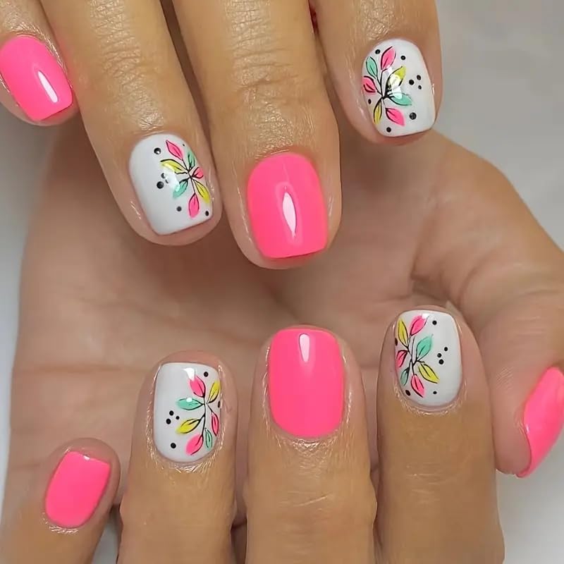 Nails with pink and white design on a neutral background
