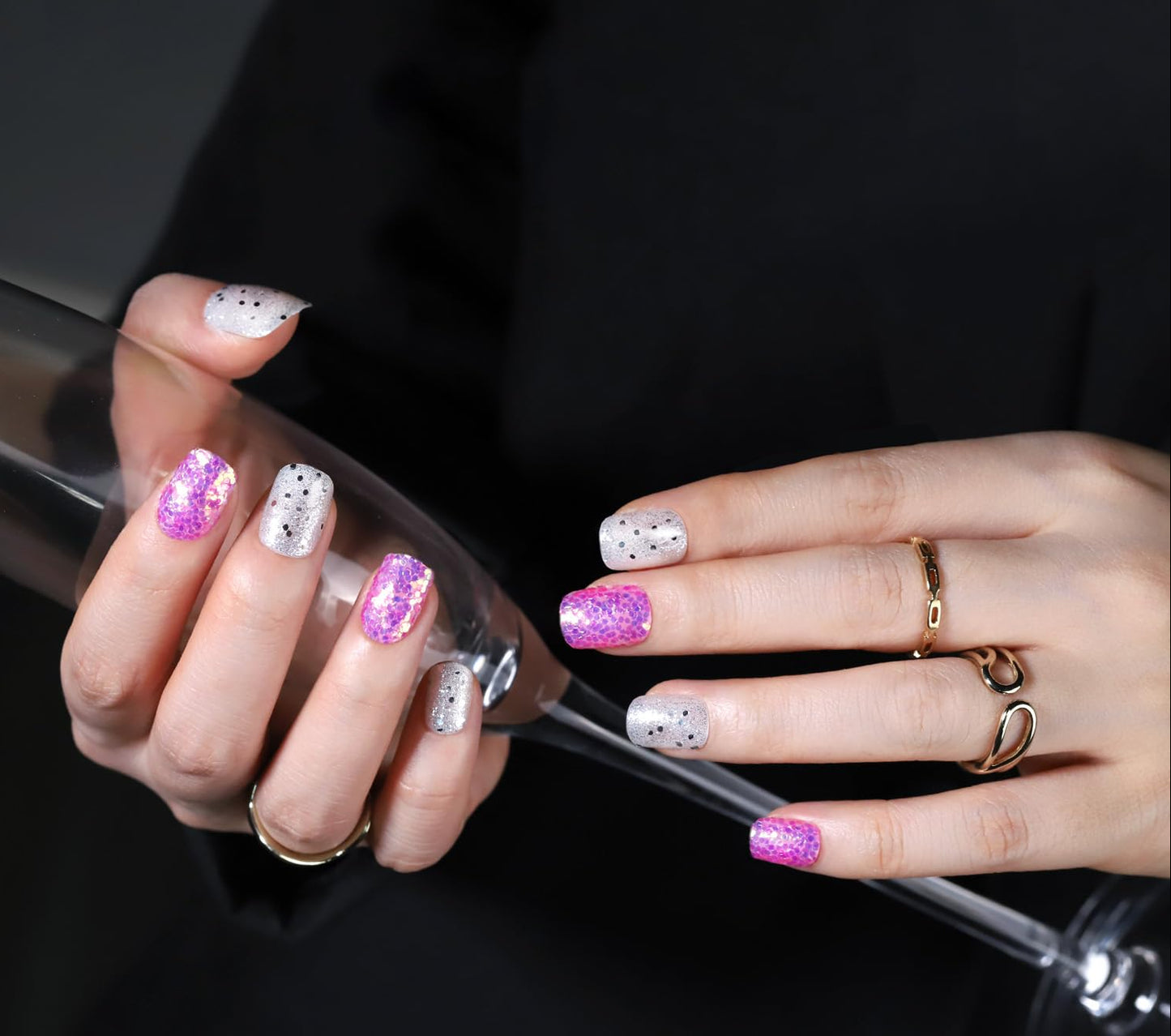 Close-up of hands with glittery nail polish holding a bottle, with FANDAMEI branding.