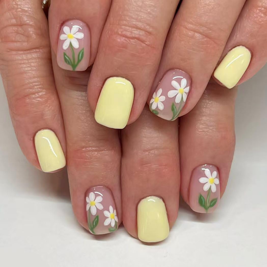 Nails with floral design on a white background