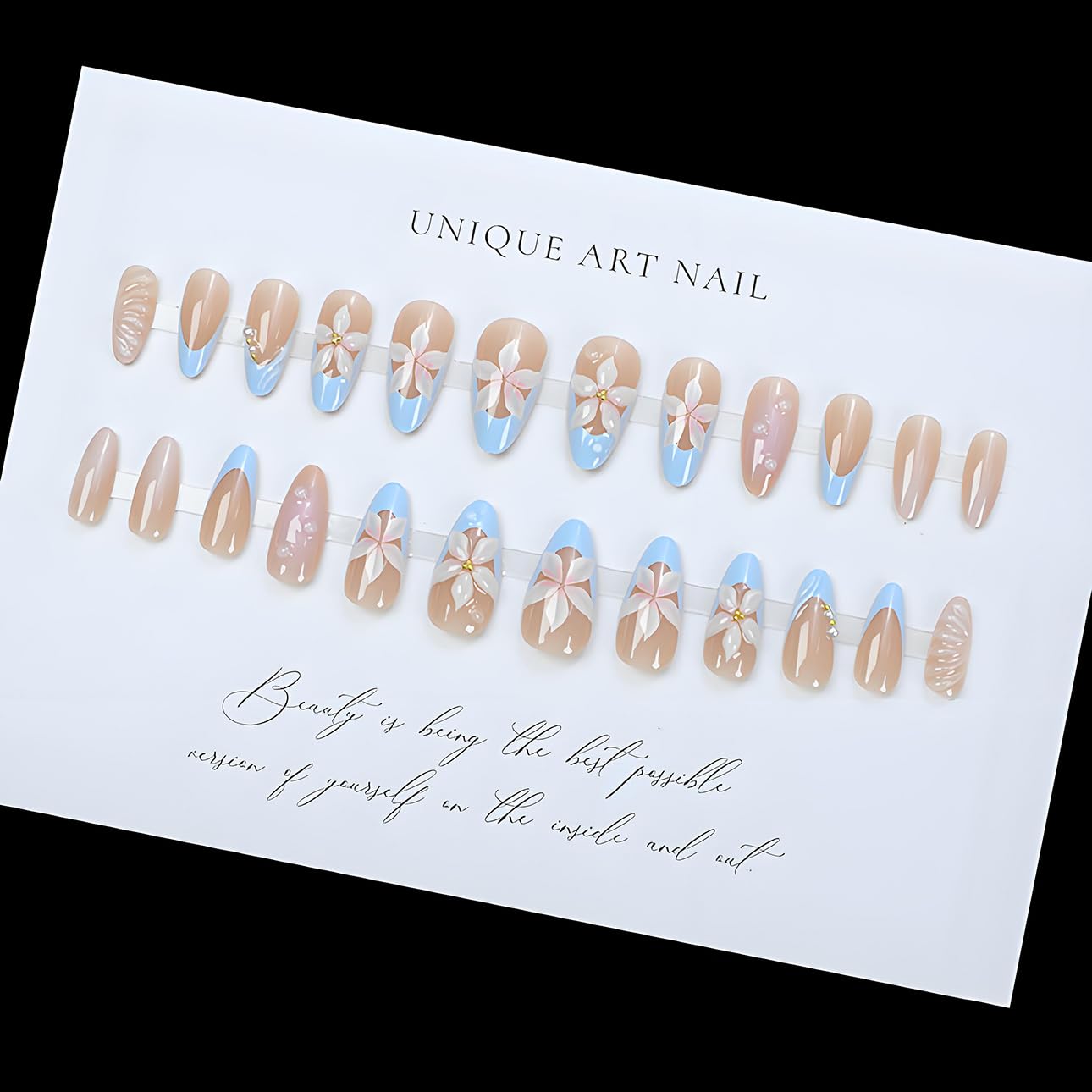Set of false nails with floral designs on a branded card