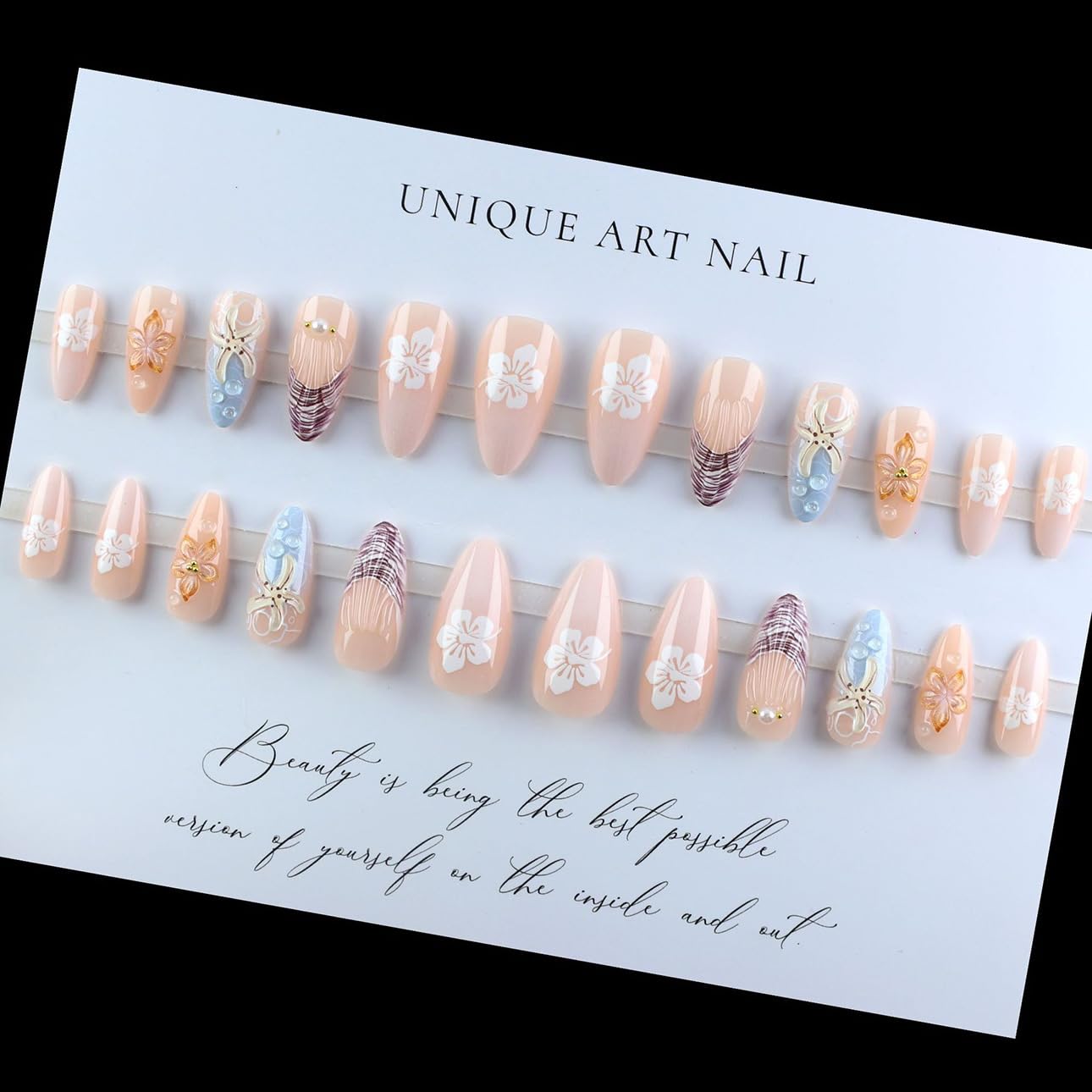 Set of decorative false nails on a display card with text.