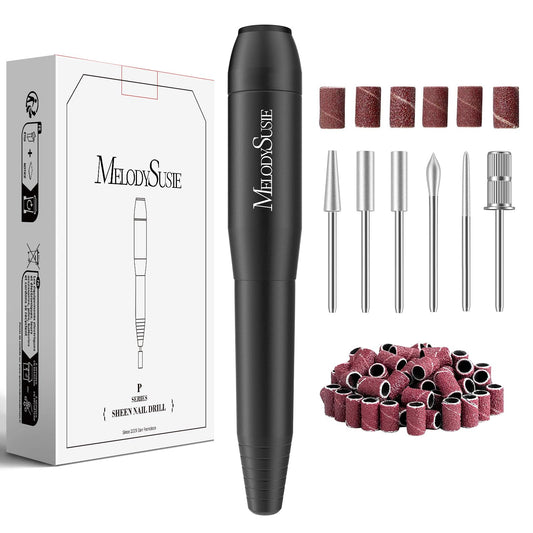 Black nail drill with accessories and packaging on a white background