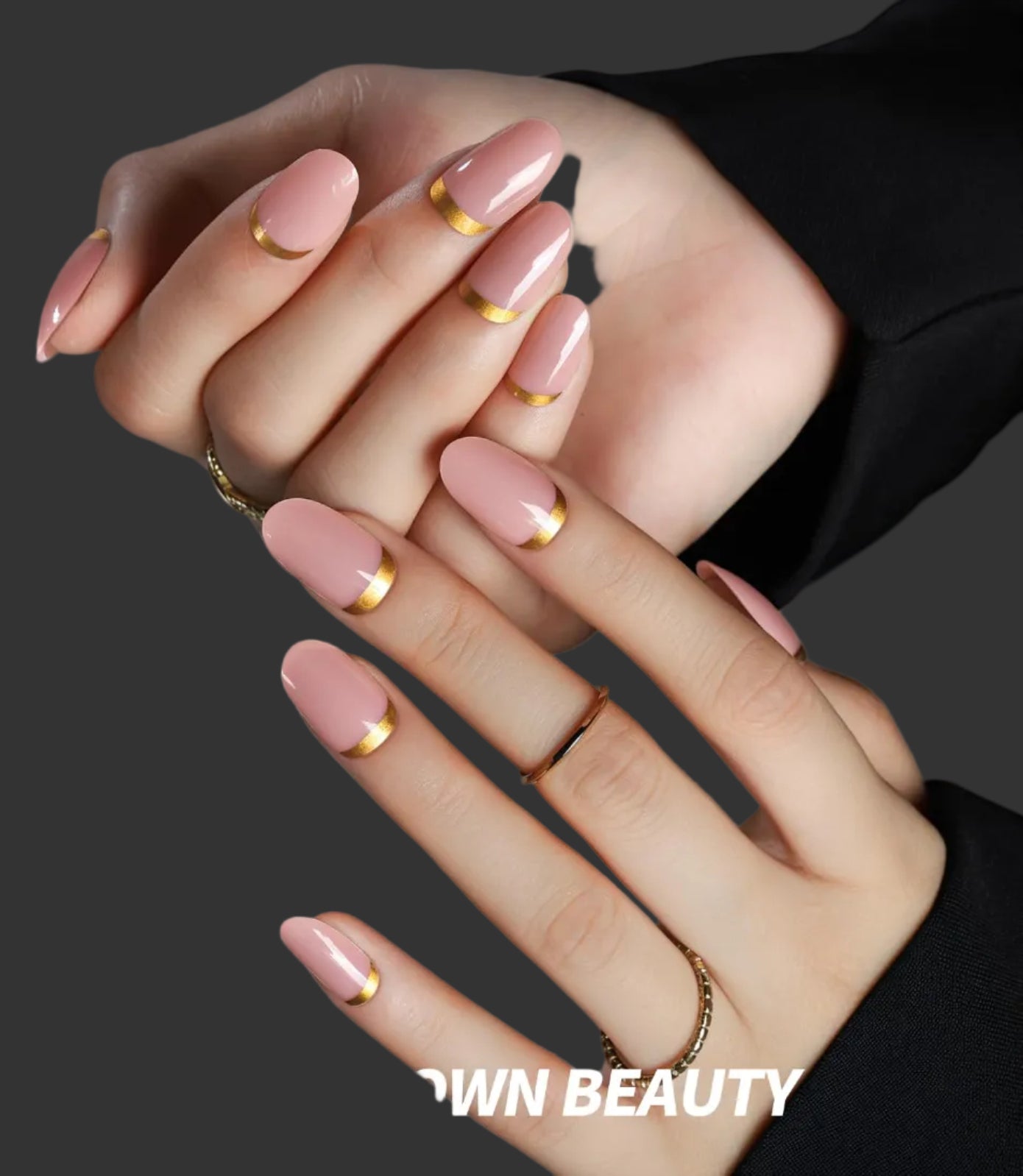 Close-up of hands with pink nails and gold accents, wearing black sleeves, with 'FANDAMEI' logo.