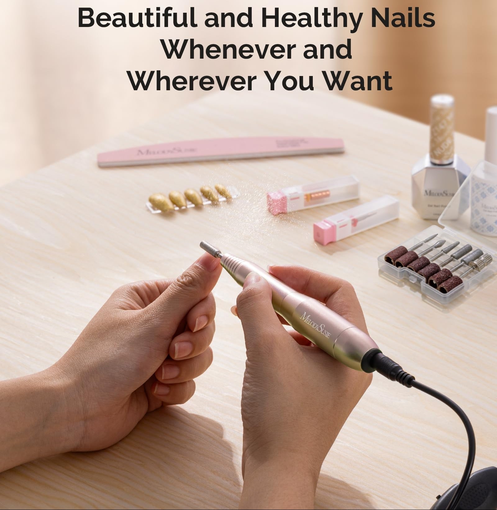 Nail drill being used with nail polish and tools on a wooden surface, featuring Melodiususie branding.