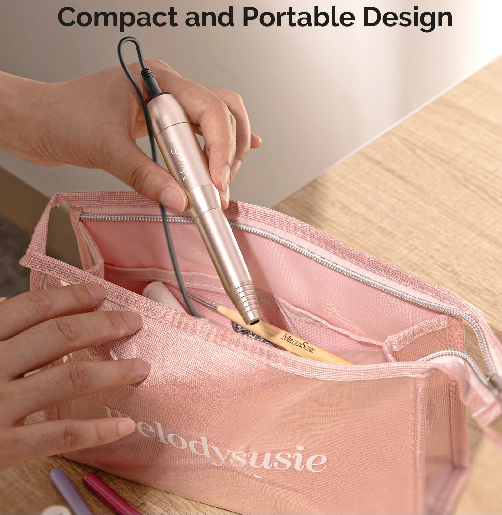 Portable nail drill in a pink bag with 'MelodySusie' branding.