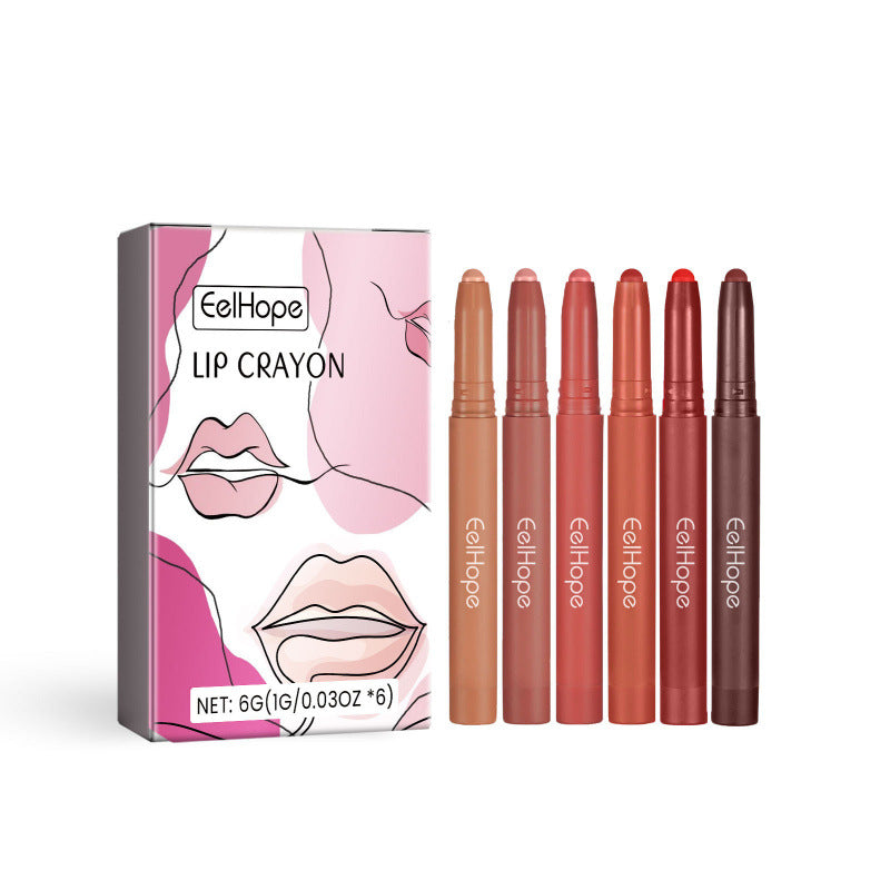 Set of lip crayons with packaging on a white background
