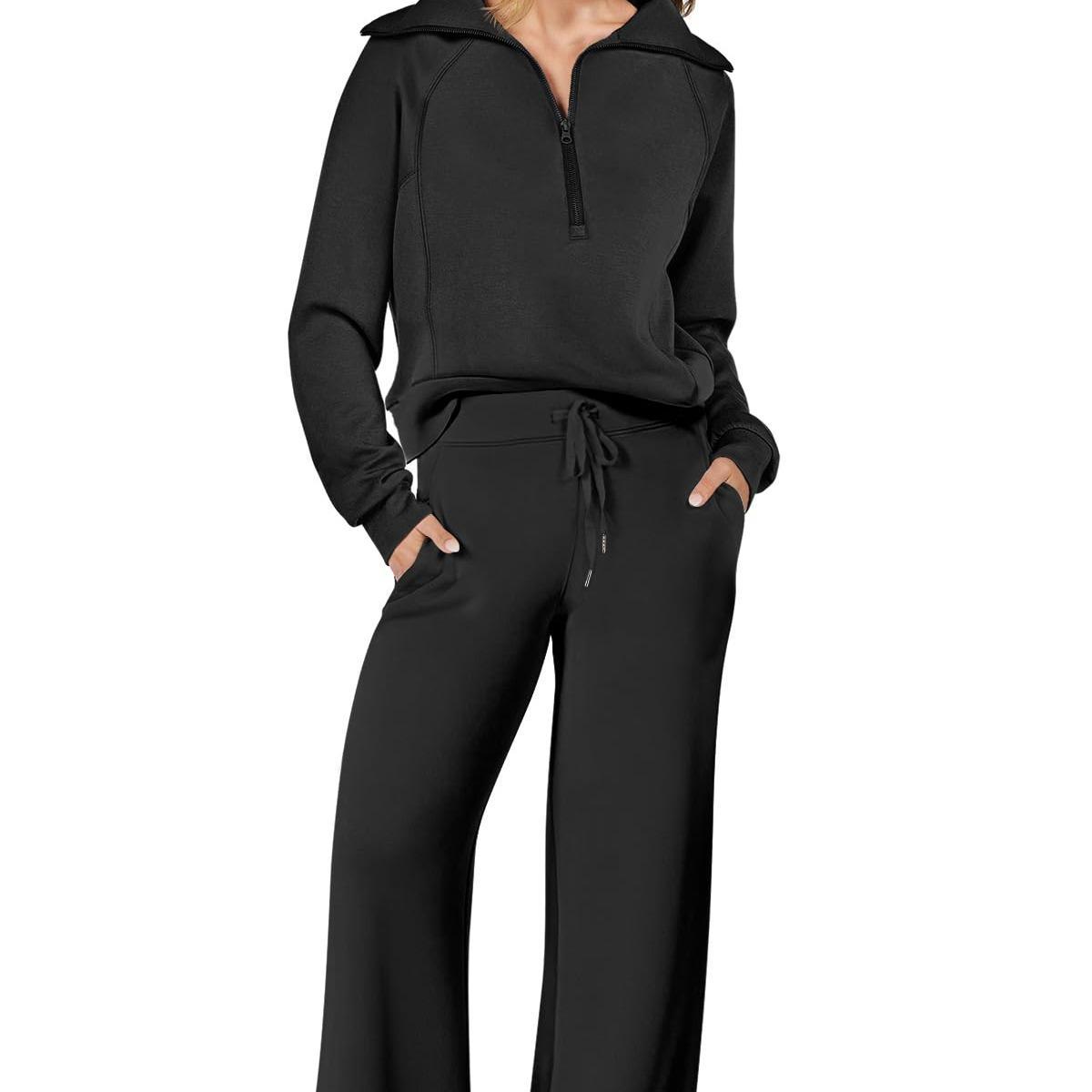 Black hoodie and pants set on a white background